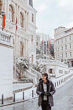 man holding a camera explore the historical city by walking