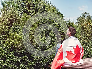 Man holding a Canadian Flag. National holiday