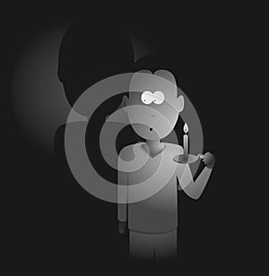 Man holding a candle in the darkness