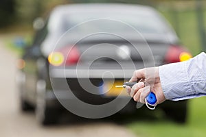 Man Holding Car Remote Key.