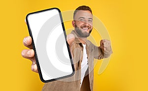 Man Holding Cell Phone With Blank Screen
