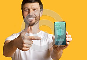 Man holding cellphone with delivery tracking website
