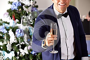 Man holding champagne at the party.