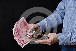 Man holding Chinese money and dragon