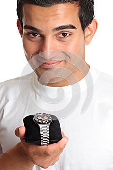 Man holding a chronograph wrist watch