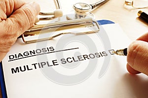 Man is holding clipboard with multiple sclerosis.
