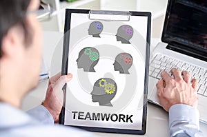 Teamwork concept on a clipboard