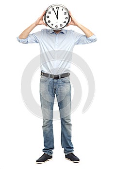 Man holding clock in front of his face