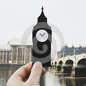 Man holding the Clock Tower in London, UK