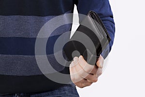 Man holding a closed wallet