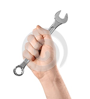 Man holding combination wrench isolated on white, closeup.