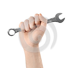 Man holding combination wrench on white, closeup. Plumbing tools