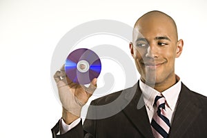 Man holding compact disc.
