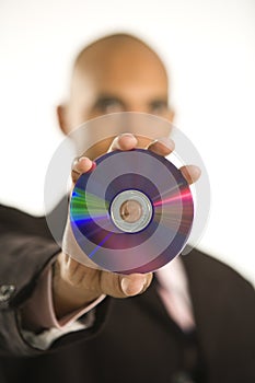 Man holding compact disc.