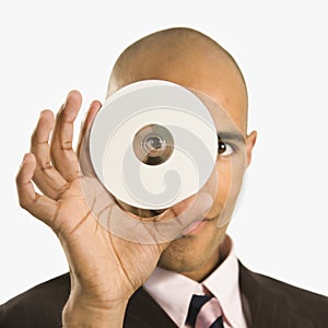 Man holding compact disc. photo