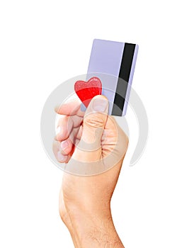 Man holding a credit card and a small heart isolated white