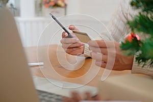 man holding credit card & smart phone for online shopping. male