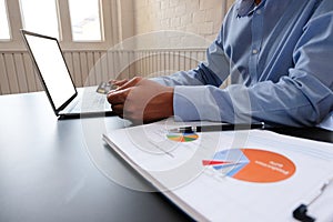 Man holding credit card using computer for online shopping. businessman make payment on website