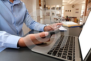 Man holding credit card using smart phone for online shopping. businessman make payment on internet