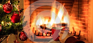 Cup of coffee on Christmas tree and burning fireplace background