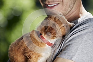 Man holding cute puppy