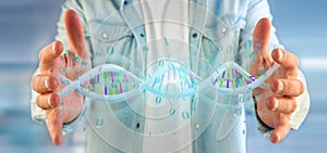Man holding a 3d rendering data coded Dna with binary file around