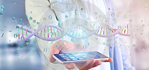 Man holding a 3d rendering data coded Dna with binary file around