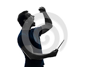 Man holding digital tablet happy joy silhouette