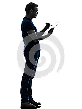 Man holding digital tablet silhouette