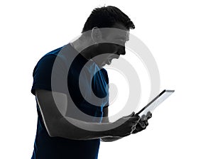 Man holding digital tablet surprised silhouette