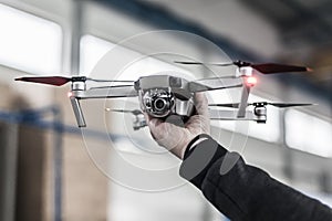 Man holding drone before take off