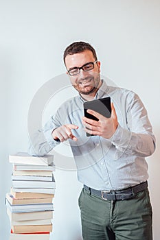 Man holding an e-book reader in hands