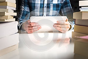 Man holding electronic book reader.