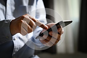 Man holding en hands and using digital tablet  Mobile Phone telephone with blank copy space scree