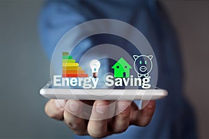 Man holding Energy Saving concept. photo