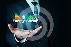Man holding Energy Saving concept.