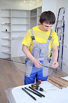 Man holding a fastening for doors sliding photo