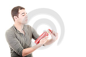 Man holding a fire extinguisher, isolated on white