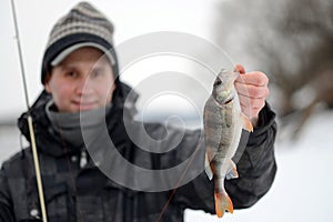 A man holding a fish caught