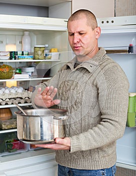 Man holding foul food