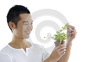 Man holding fresh sprout