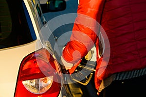 man holding a fuel nozzle