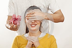 Man holding gift box and giving girlfriend