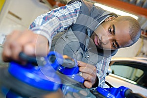 Man holding glass with suction pads