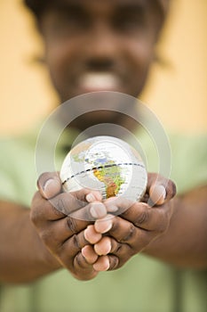 Man holding globe.