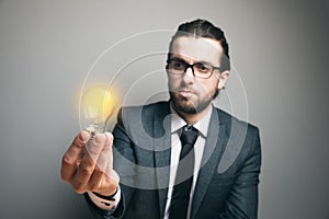 Man holding a glowing lamp. concept idea