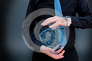 Man holding glowing polygonal brain on dark background