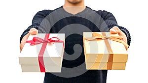 Man holding a gold and silver gift box on a white background