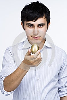 Man holding golden egg