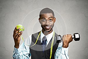 Man holding green apple dumbbell